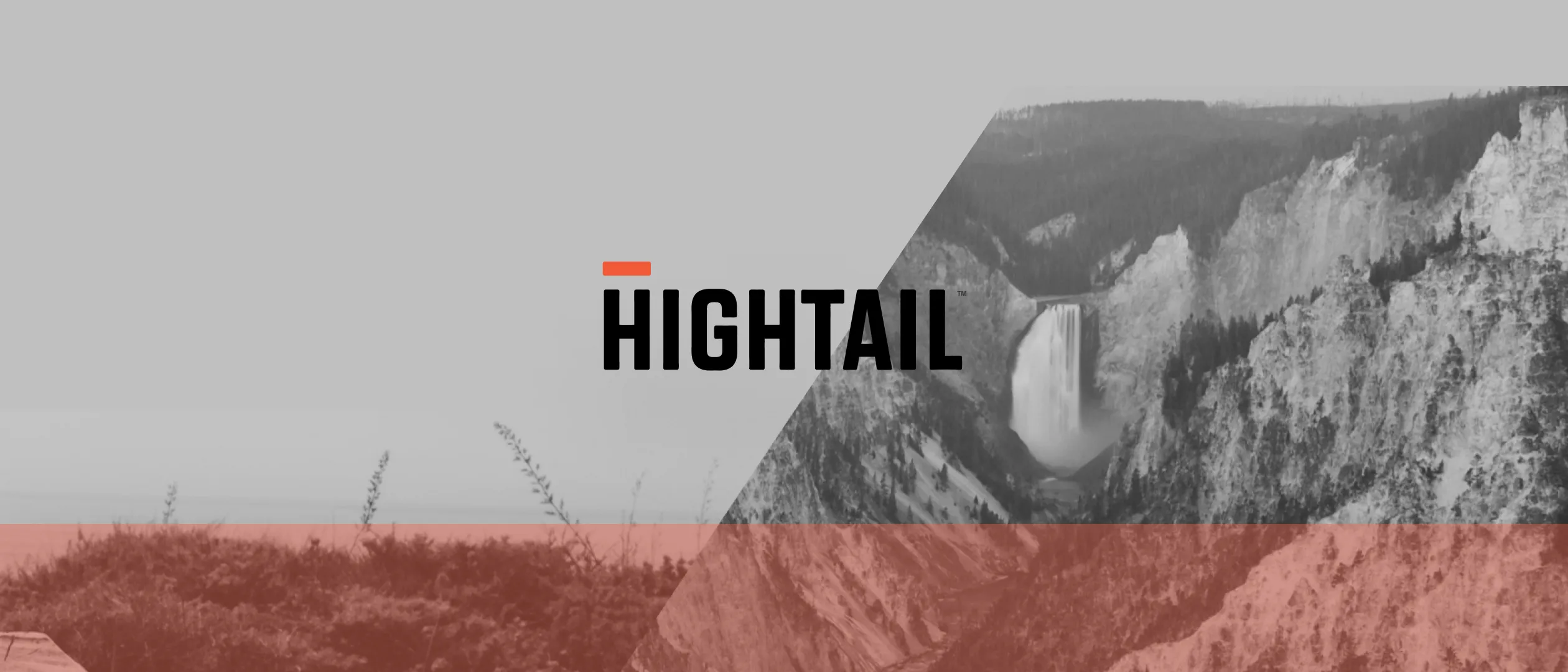 The Hightail logo over a black-and-white canyon photo with a red band